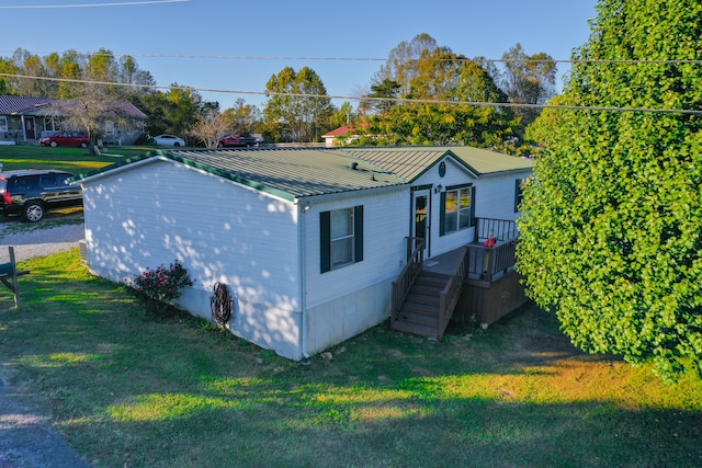 view of property exterior with a lawn