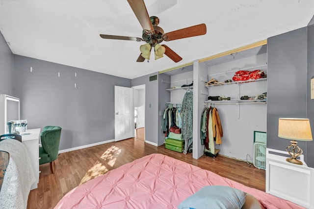 bedroom featuring hardwood / wood-style floors and ceiling fan