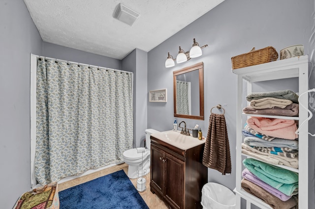 bathroom featuring a textured ceiling, toilet, a shower with curtain, vanity, and hardwood / wood-style flooring