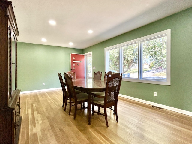 dining space with light wood-type flooring