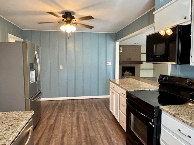 kitchen featuring white cabinetry, black appliances, light stone counters, and dark hardwood / wood-style flooring