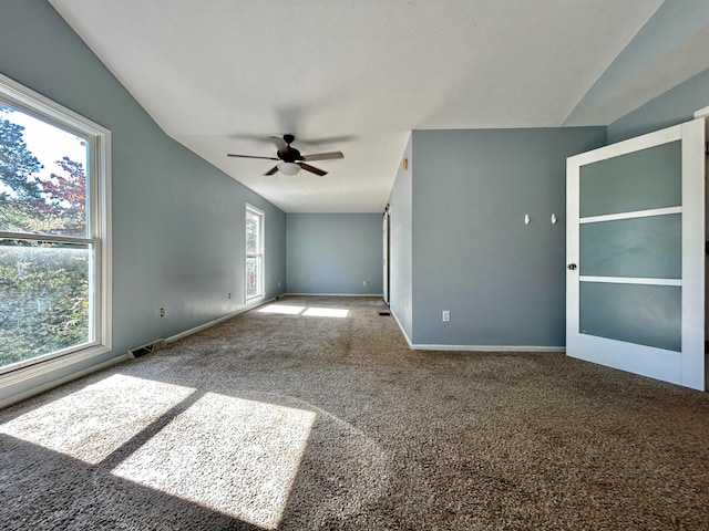 spare room with carpet floors and ceiling fan