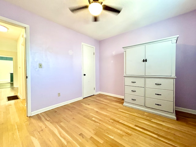 unfurnished bedroom with light hardwood / wood-style floors and ceiling fan