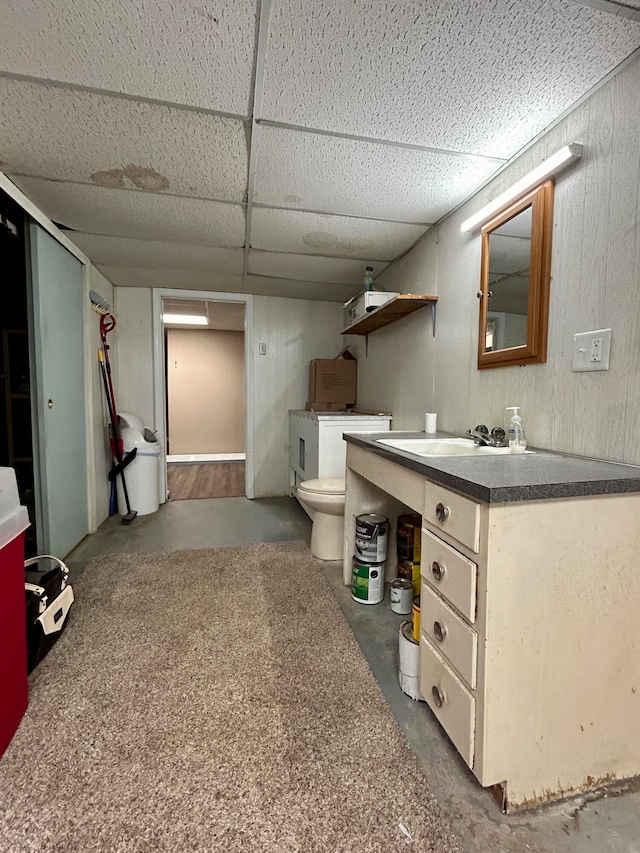 interior space featuring sink and a paneled ceiling