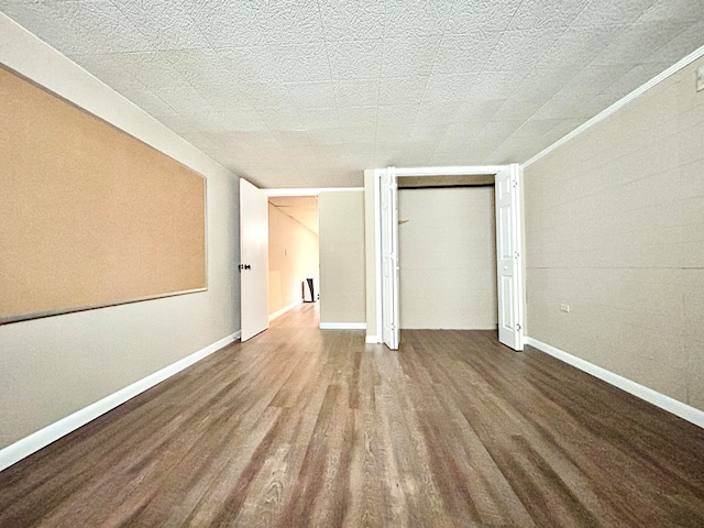 unfurnished bedroom with a closet and hardwood / wood-style flooring