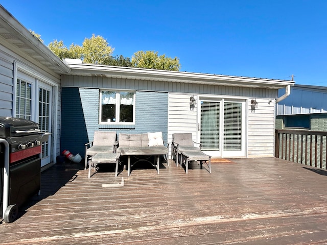 wooden terrace featuring grilling area