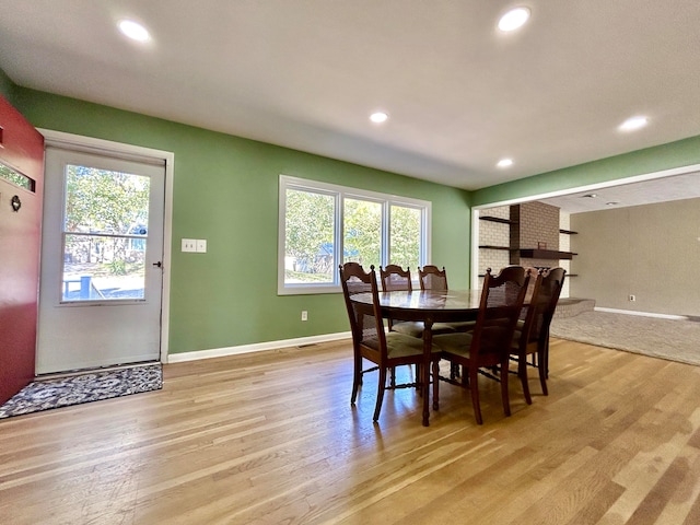 dining room featuring light hardwood / wood-style floors and a healthy amount of sunlight