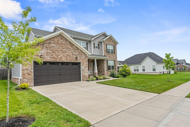 view of front of property with a front yard and a garage