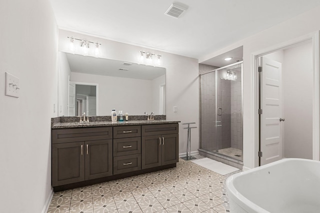 bathroom featuring vanity, tile patterned flooring, and plus walk in shower