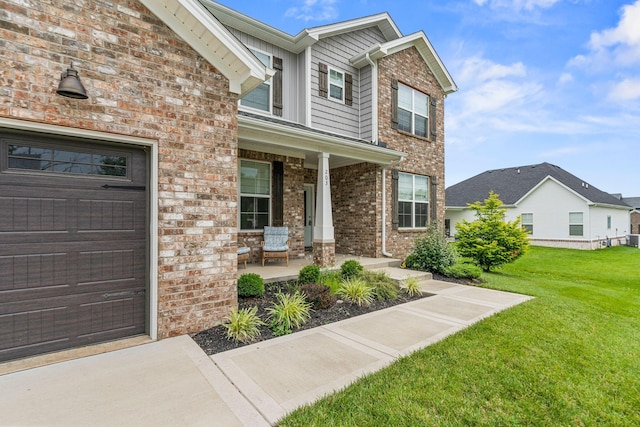 entrance to property featuring central AC, a lawn, and a porch