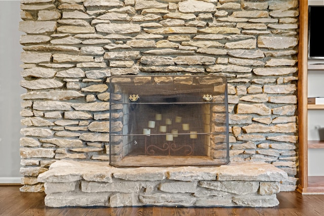 interior details with hardwood / wood-style flooring and a fireplace