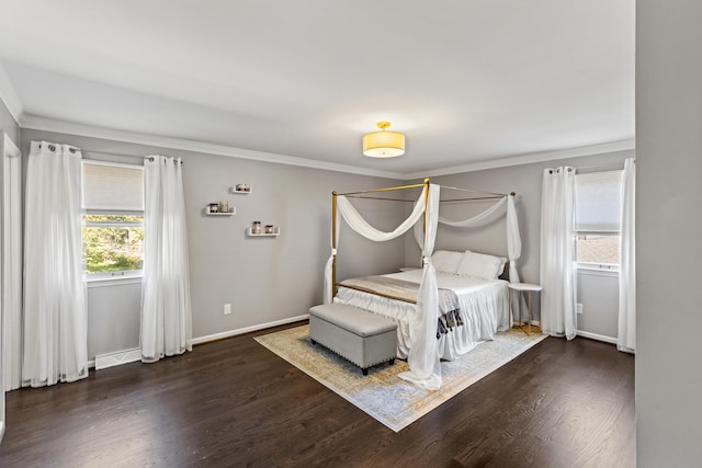 unfurnished bedroom with ornamental molding and dark wood-type flooring