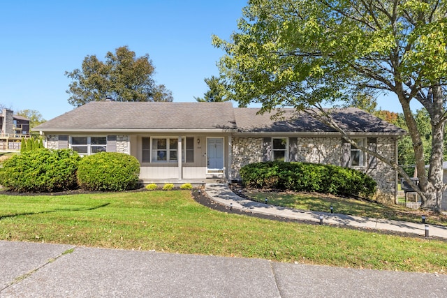 ranch-style home with a front yard