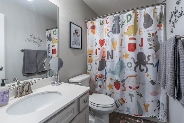 bathroom with vanity, toilet, tile patterned flooring, and a shower with shower curtain