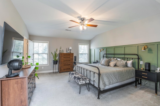 bedroom with lofted ceiling, light carpet, and ceiling fan