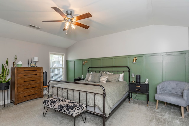 carpeted bedroom with vaulted ceiling and ceiling fan