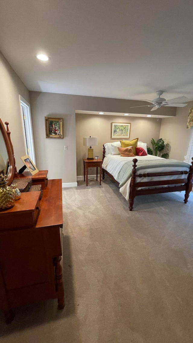 bedroom with ceiling fan and carpet