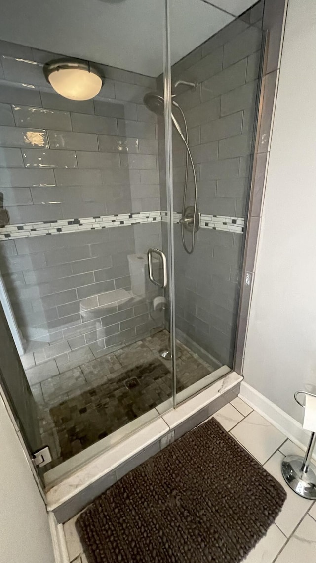 bathroom featuring tile patterned floors and walk in shower