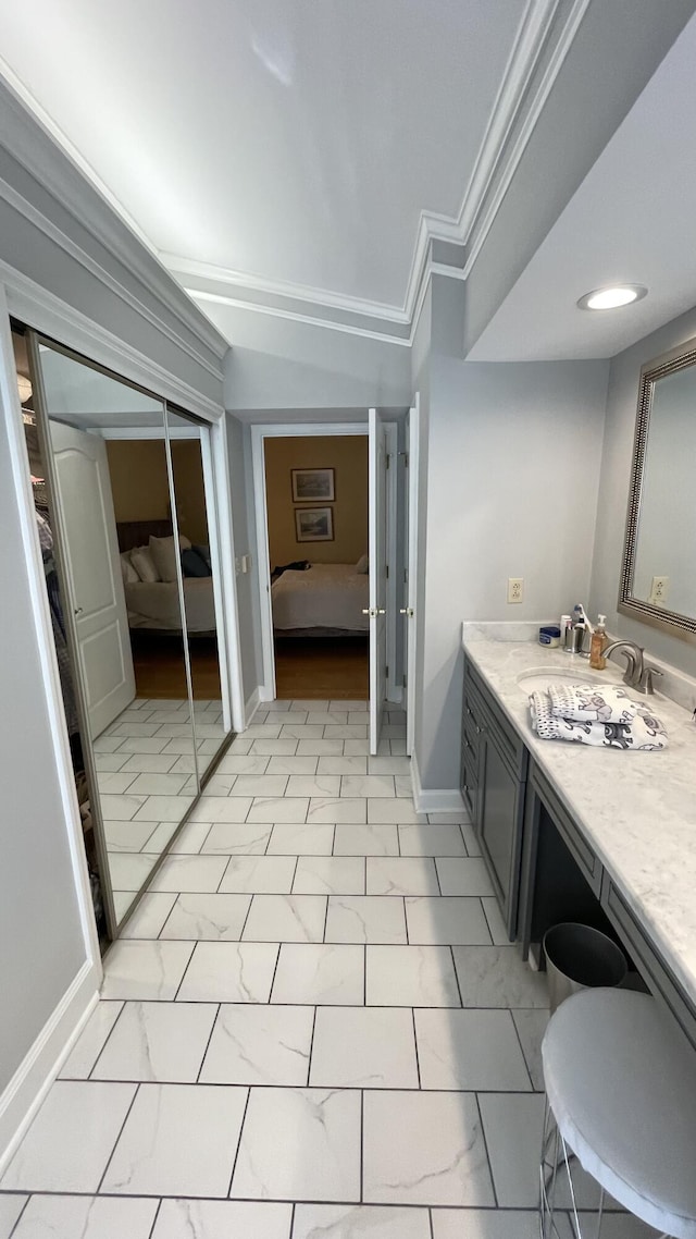 bathroom featuring vanity and ornamental molding