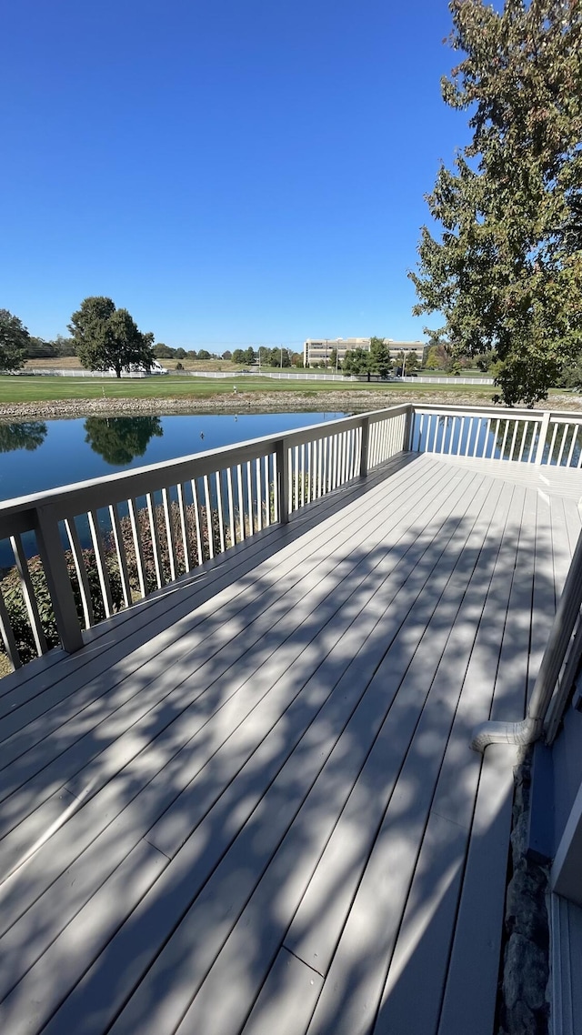 wooden deck with a water view