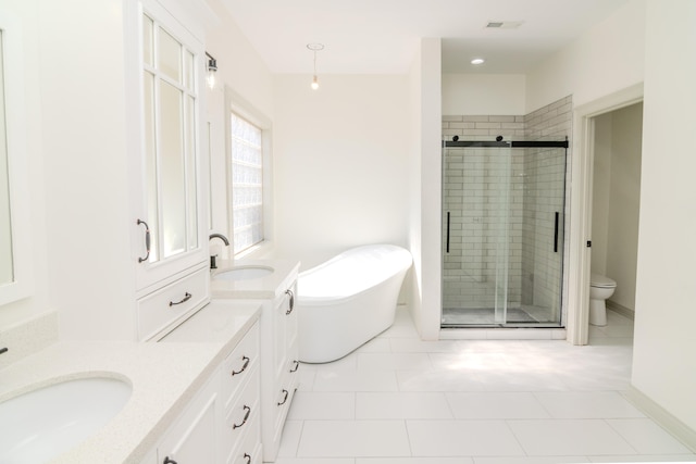 full bathroom with toilet, independent shower and bath, vanity, and tile patterned floors