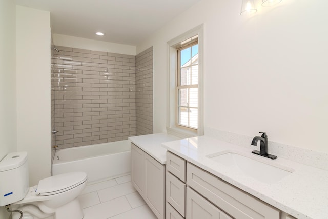 full bathroom featuring vanity, tiled shower / bath combo, toilet, and tile patterned floors