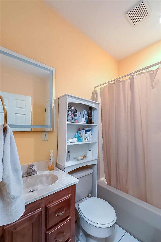 full bathroom featuring vanity, shower / bath combo, toilet, and tile patterned floors