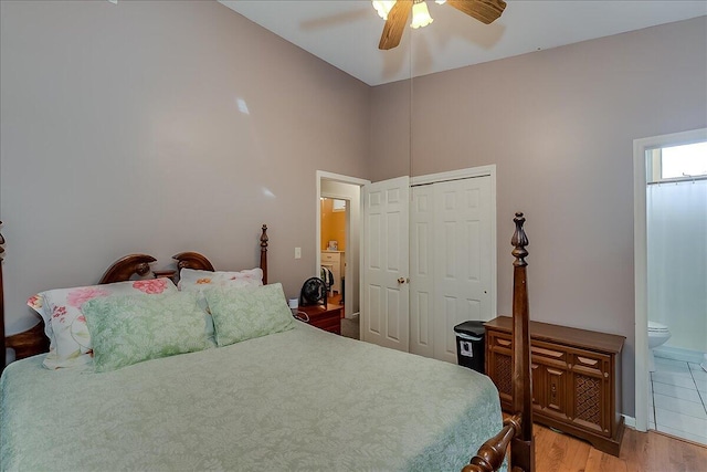 bedroom with a closet, ceiling fan, light hardwood / wood-style flooring, and ensuite bathroom