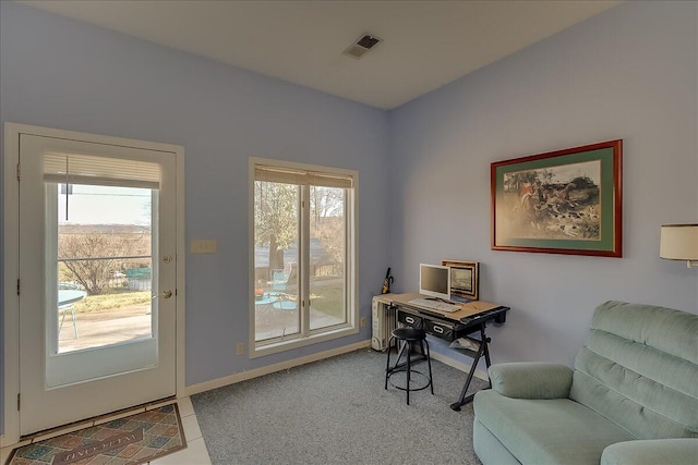 office area with plenty of natural light and light colored carpet