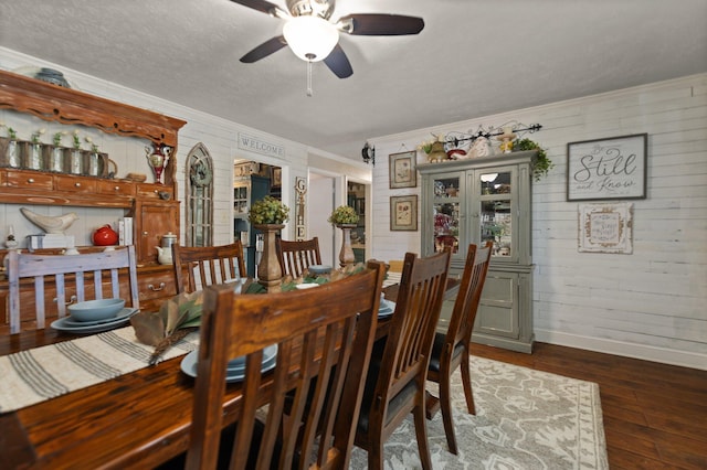 dining room featuring ornamental molding, ceiling fan, and dark hardwood / wood-style flooring