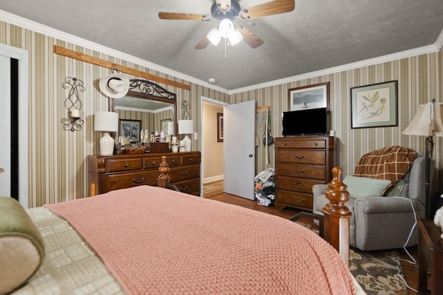 bedroom with ceiling fan, ornamental molding, and hardwood / wood-style floors