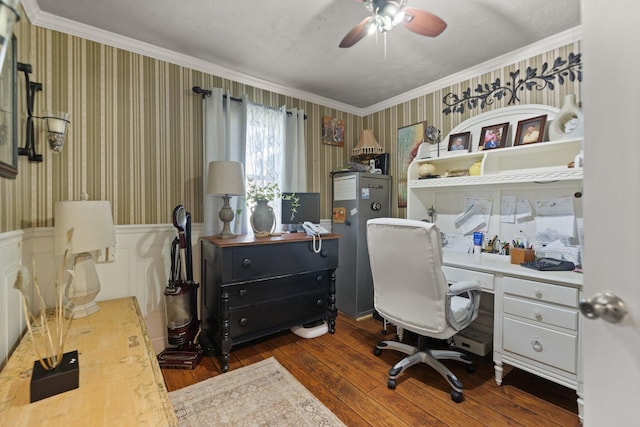 home office featuring built in desk, a textured ceiling, dark hardwood / wood-style flooring, ceiling fan, and crown molding