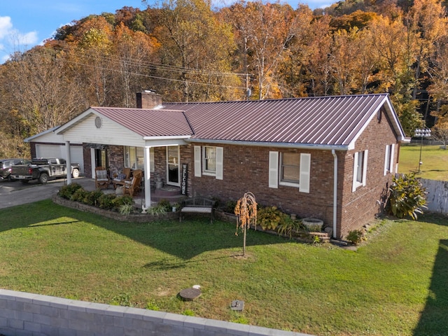 ranch-style home with a front lawn