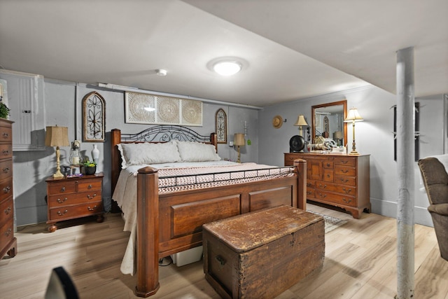 bedroom with light hardwood / wood-style floors