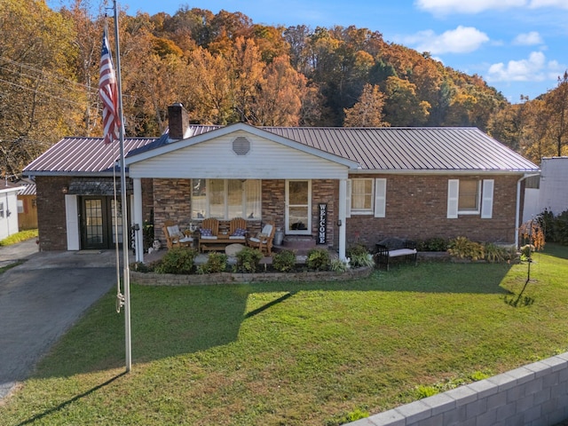 single story home featuring a front yard and covered porch