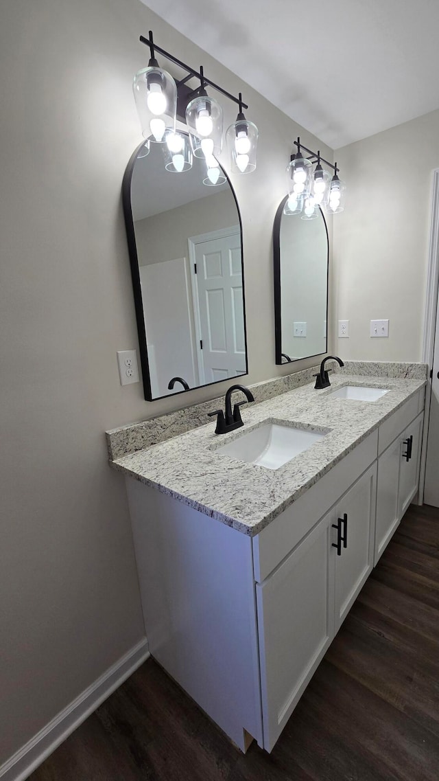 bathroom with vanity and hardwood / wood-style floors