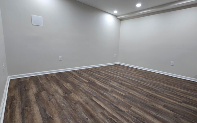 spare room featuring dark hardwood / wood-style floors