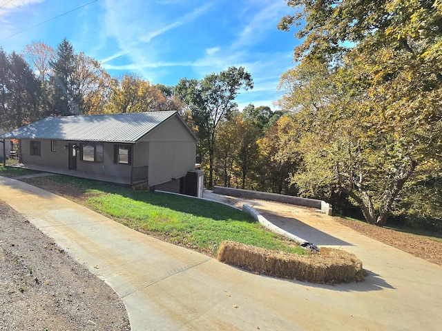 view of property exterior featuring a lawn