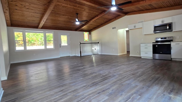 kitchen with white cabinets, vaulted ceiling with beams, stainless steel appliances, and wood-type flooring