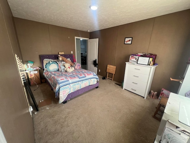 carpeted bedroom with a textured ceiling