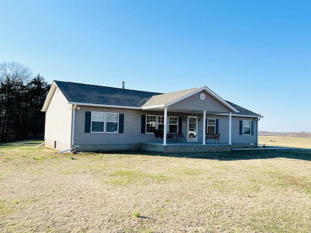 ranch-style home with a front lawn