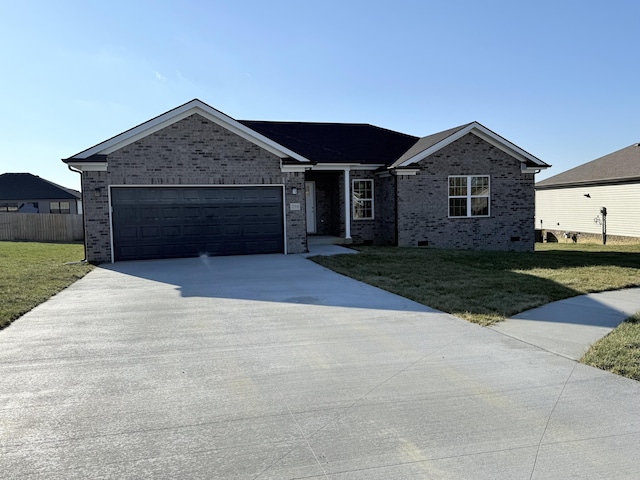 ranch-style house featuring a front lawn and a garage