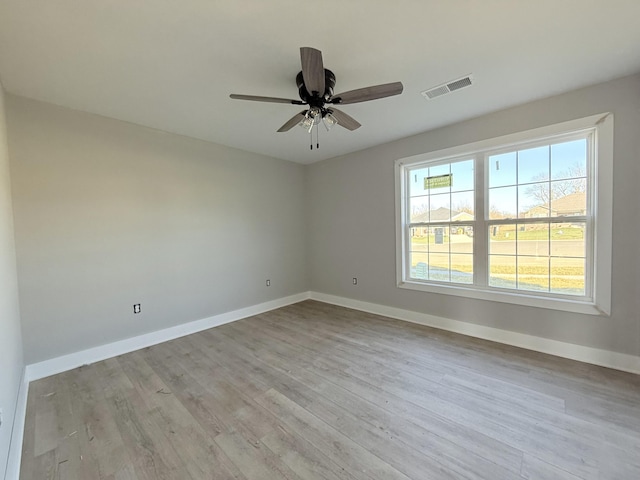 spare room featuring ceiling fan and light wood-type flooring