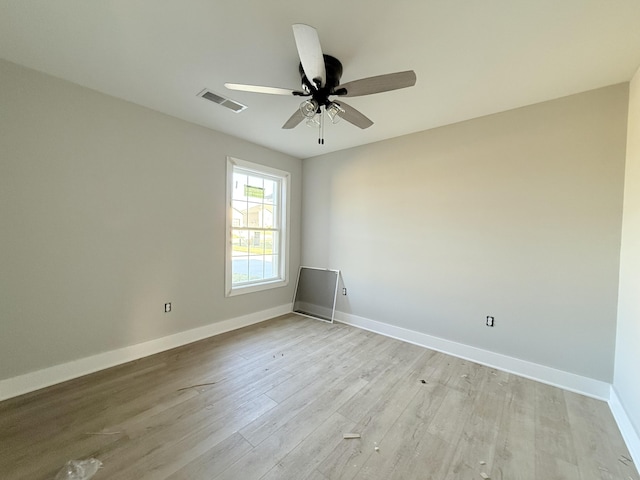 spare room with ceiling fan and light hardwood / wood-style flooring