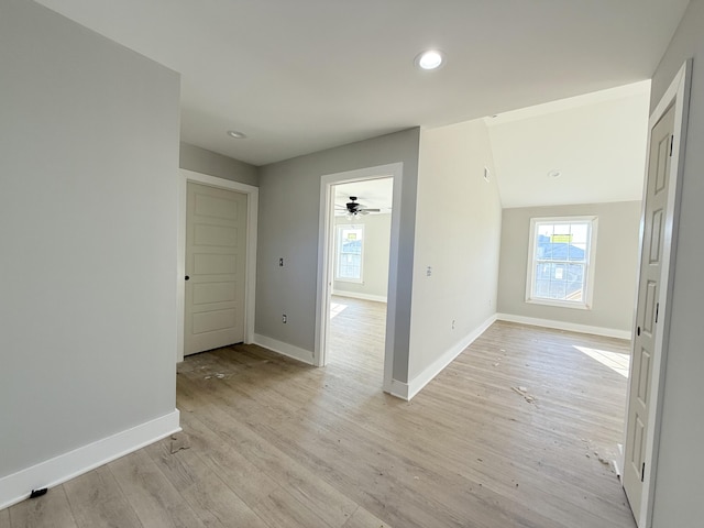 unfurnished room with light wood-type flooring and ceiling fan