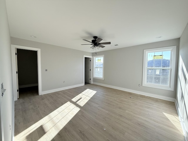 unfurnished room featuring ceiling fan and light hardwood / wood-style flooring