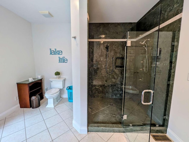 bathroom with toilet, walk in shower, and tile patterned flooring