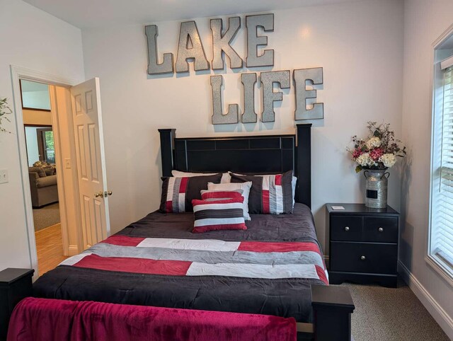 bedroom with light tile patterned floors, access to outside, and ceiling fan