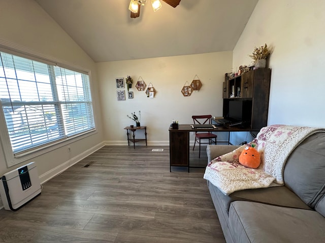 home office with dark wood-type flooring, ceiling fan, and vaulted ceiling