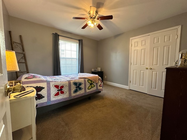 carpeted bedroom with a closet and ceiling fan